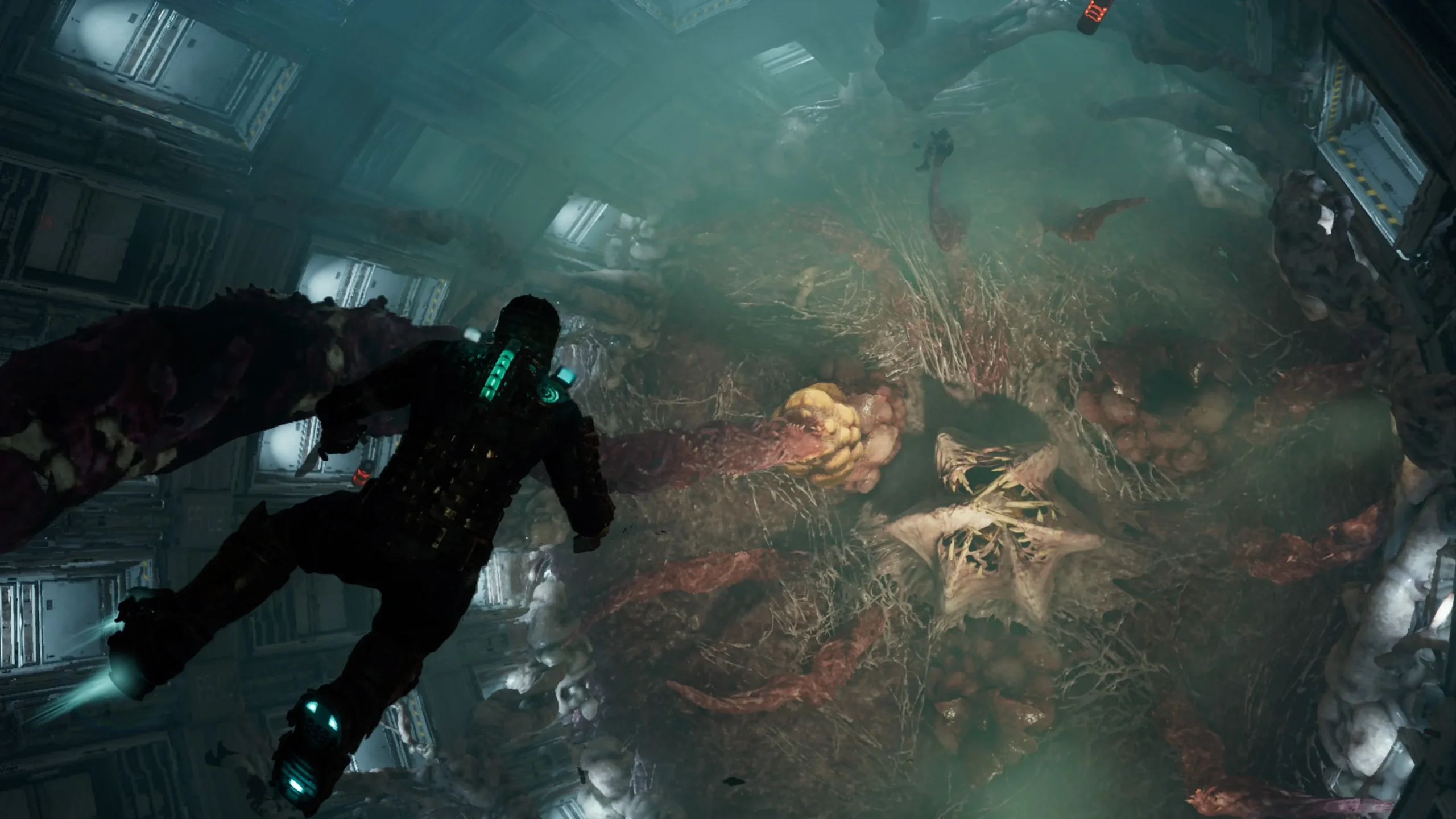 Isaac Clarke diante de um ambiente industrial tomado por matéria orgânica em Dead Space.
